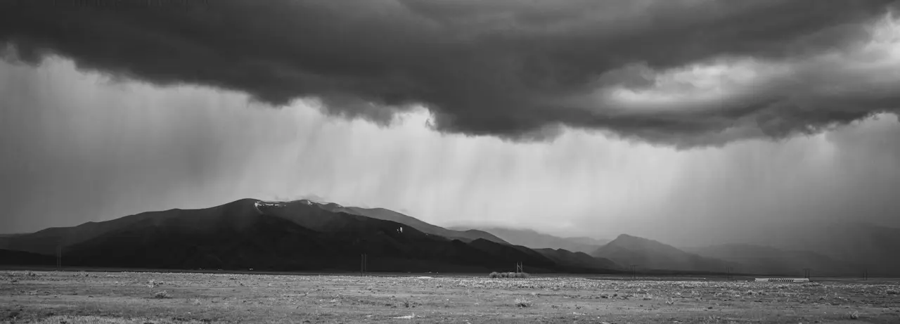 A%20storm%20deluges%20distant%20mountains%20in%20Montana.