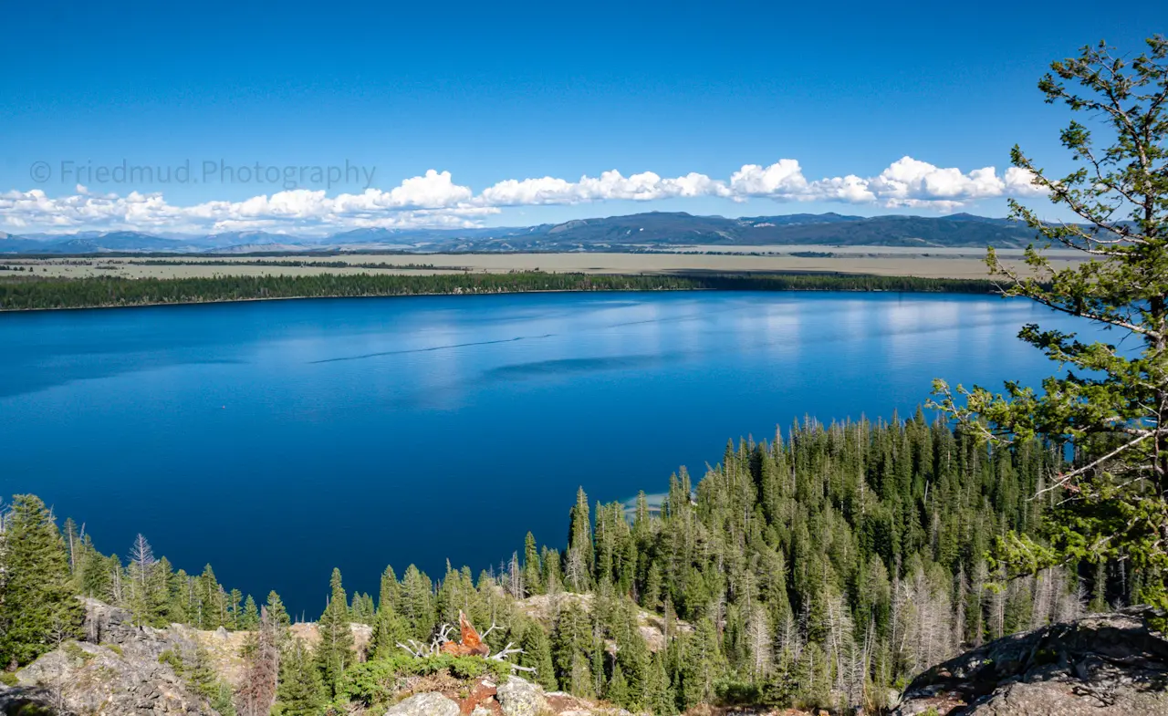 Jenny%20lake%20is%20insanely%20blue%20as%20viewed%20from%20Inspiration%20Point%20at%20the%20trailhead%20for%20Cascade%20Canyon%20in%20Teton%20National%20Park.