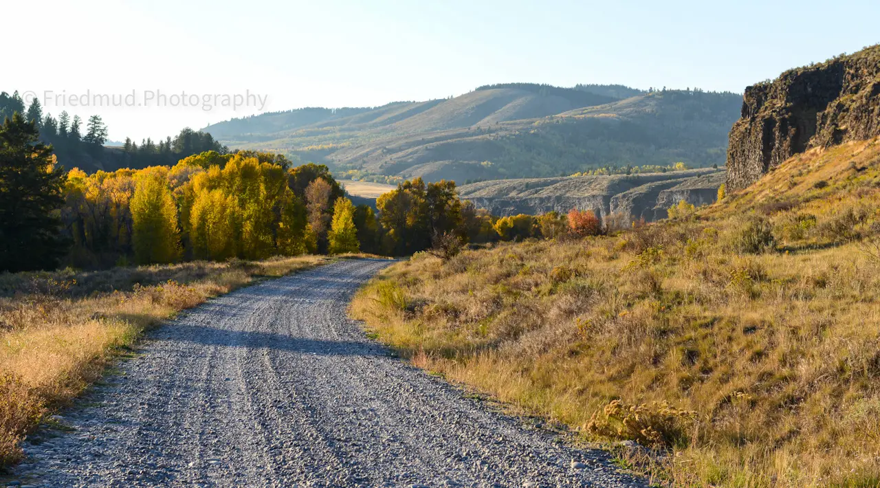 The%20gravel%20road%20dissappears%20around%20a%20bend%20in%20the%20Snake%20River.