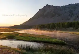 The%20mist%20rising%20from%20the%20Madison%20River%20in%20Yellowstone%20National%20Park%20glows%20in%20the%20morning%20light.