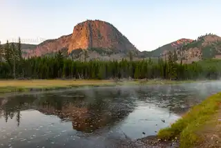 The%20morning%20light%20catches%20the%20cliffs%20above%20the%20Madison%20River%20in%20the%20western%20part%20of%20Yellowstone%20National%20Park.