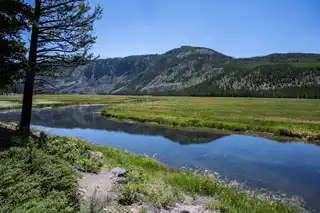 A%20still%20moment%20along%20the%20river%20near%20the%20western%20entrance%20to%20Yellowstone%20National%20Park.