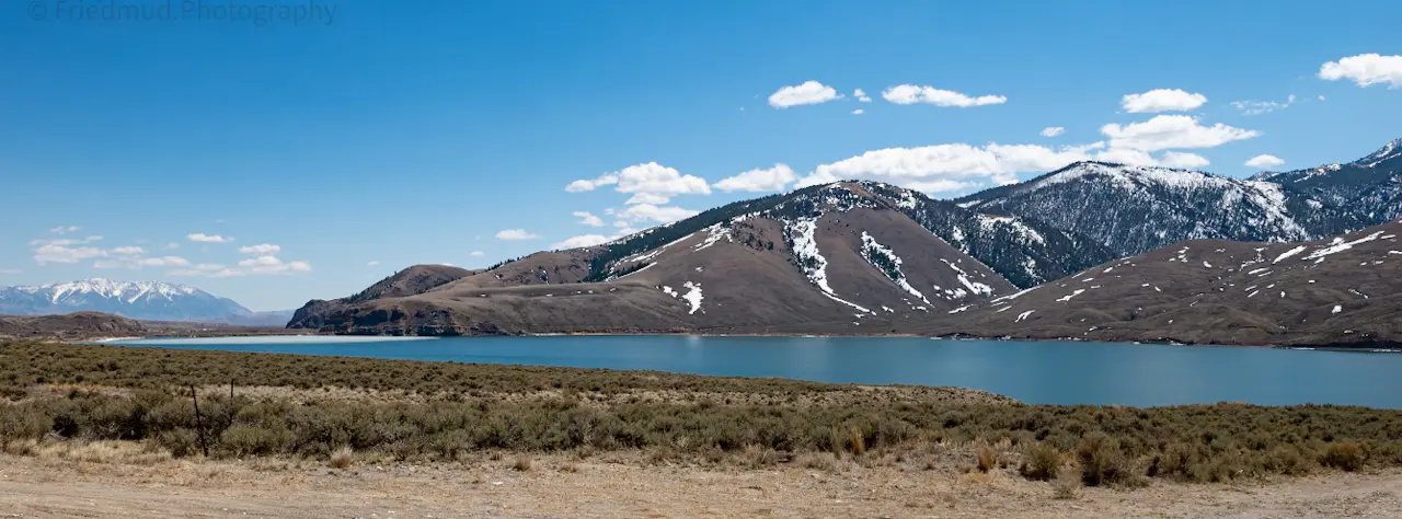 The%20partially%20frozen%20Mackay%20reservoir%20in%20central%20idaho%20is%20a%20blue%20streak%20in%20the%20early%20spring%20landscape.