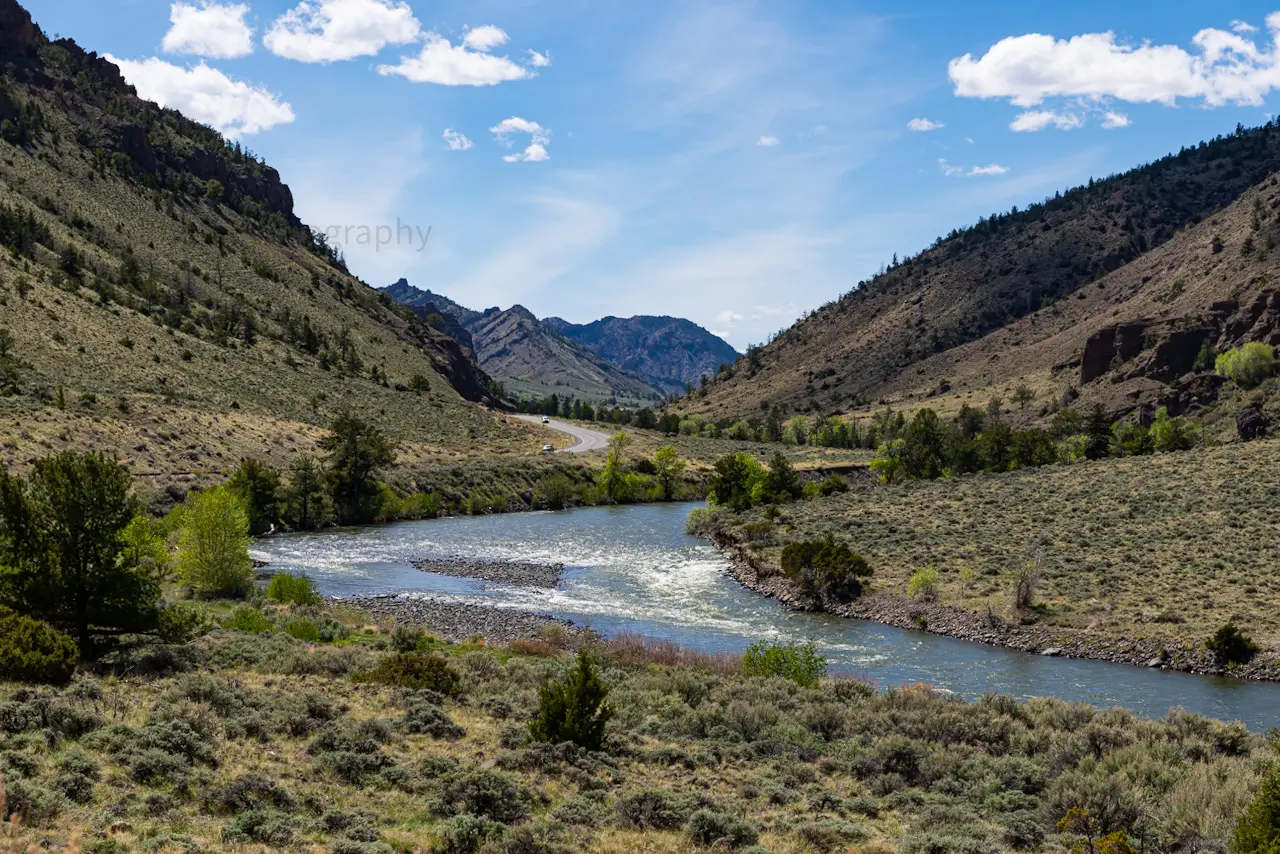 The%20road%20winding%20along%20the%20North%20Fork%20of%20the%20Shoshone%20River%20near%20Cody%2C%20WY