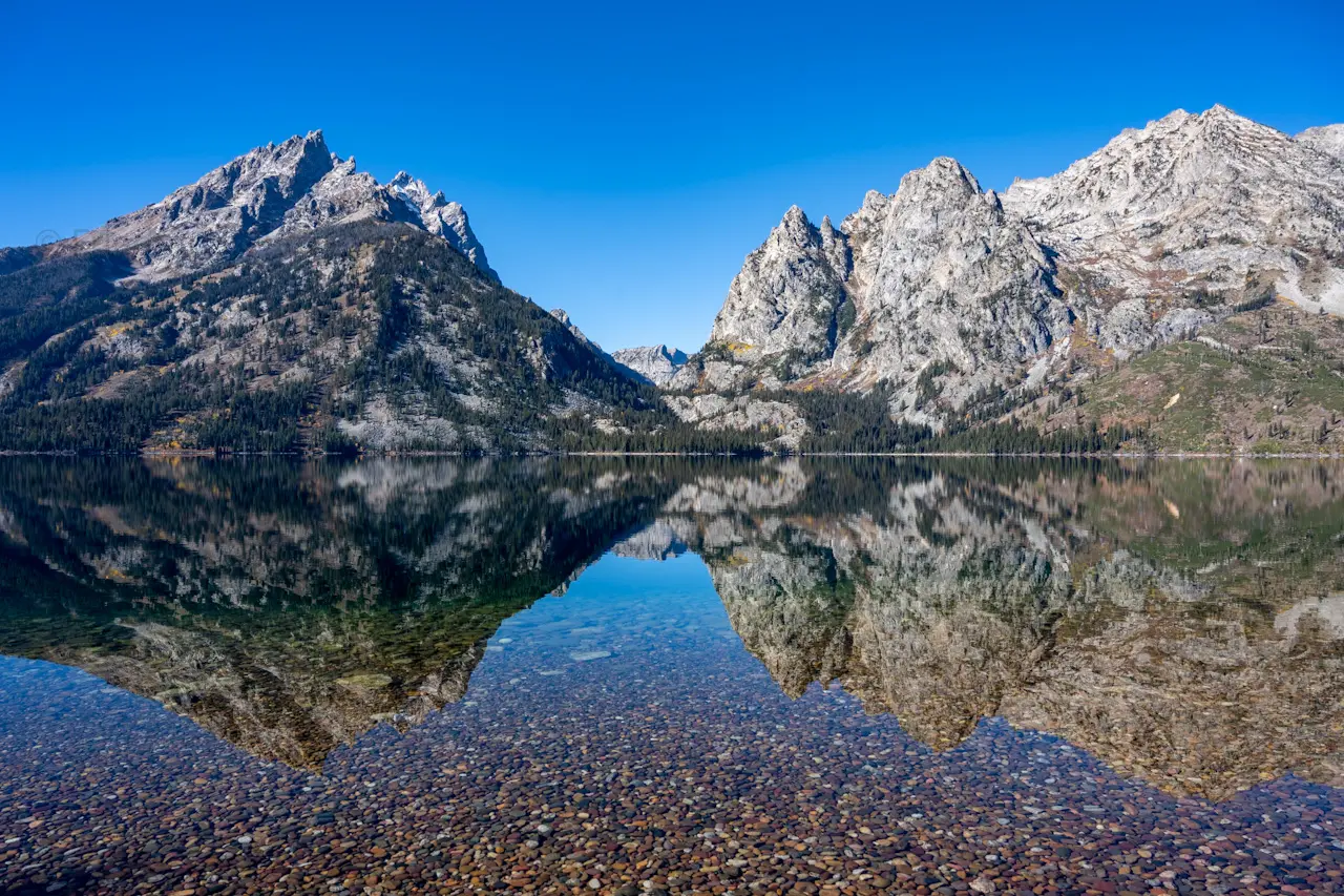 The%20Tetons%20are%20reflected%20in%20a%20perfectly%20still%20and%20clear%20Jenny%20Lake.