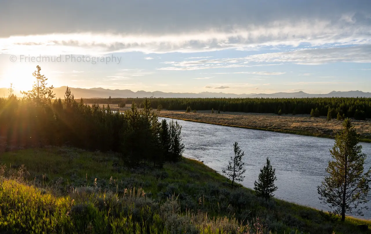 Sun%20going%20down%20over%20the%20river%20in%20Yellowstone%20National%20Park.